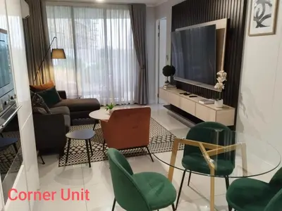 a living room with a couch and a tv at Waterfall Luxury Apartment in Midrand