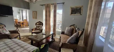 a living room with couches and a table at 7-on-Burger in Polokwane