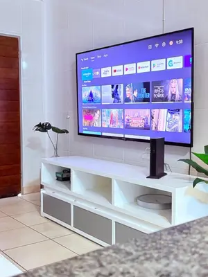 a flat screen tv sitting on a white entertainment center at 43 Home self Catering with backup power and High speed WiFi in Witbank