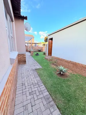 a yard with a brick walkway next to a building at 43 Home self Catering with backup power and High speed WiFi in Witbank