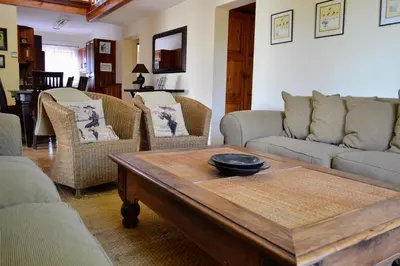 a living room with couches and a coffee table at Upstream in Dullstroom