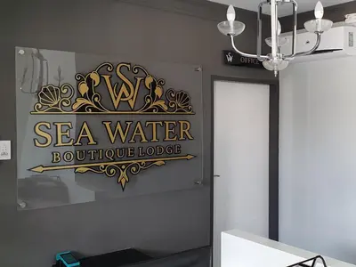 a sign for a sea water boutique lodge on a wall at SEA WATER BOUTIQUE LODGE in Mankweng unit G in Polokwane