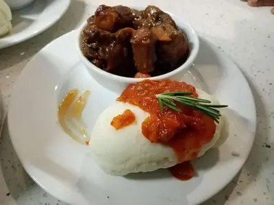 a plate of food with mashed potatoes and a bowl of food at SEA WATER BOUTIQUE LODGE in Mankweng unit G in Polokwane