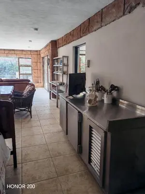 a living room with a counter top and a couch at House Olive in Pretoria