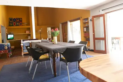 a dining room with a table and chairs at Sanctuary in Dullstroom