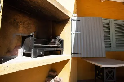 a brick oven in a building with a bench next to it at Sanctuary in Dullstroom