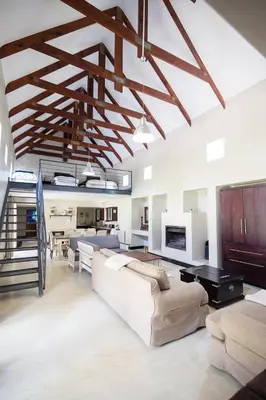 a living room with a couch and a table at Sorgenvrei in Dullstroom