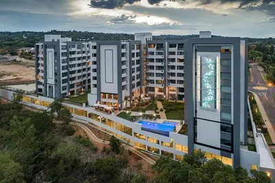 an aerial view of a large apartment building at Luxury 2BR Loft with Patio Near Menlyn at the Regency in Pretoria