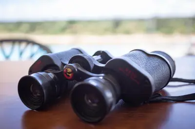a pair of binoculars sitting on top of a table at Buffalo Brooke in Hectorspruit