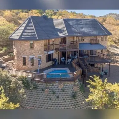 an aerial view of a house with a swimming pool at Boabab Lodge in Mabula
