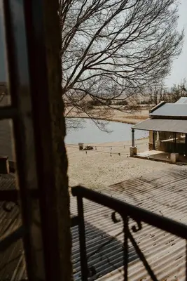 a view of a beach from a house at African Leaves Trout Lodge in Dullstroom