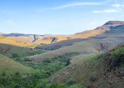 a view of a valley in the mountains at Highland Run Fly Fishing Estate by Dream Resorts in Lydenburg