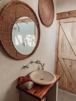 a bathroom with a sink and a mirror on the wall at Shepherds Rest in Hoedspruit