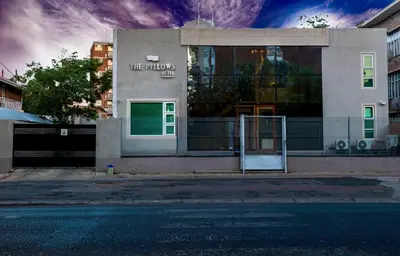 a building with an open door on a street at The Pillows Suite in Pretoria