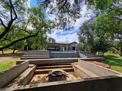a house with a swimming pool in a yard at No 16 Elements - 5 Bedroom Beauty in Moheme