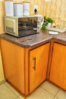 a microwave sitting on top of a kitchen counter at LEMEK Heights in Ga-Mothiba