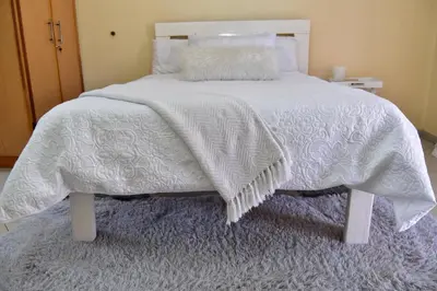 a white bed with a white blanket and pillows at LEMEK Heights in Ga-Mothiba