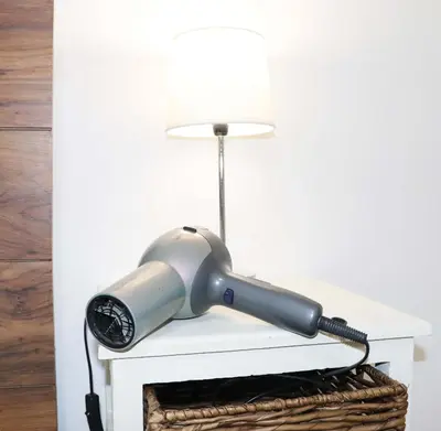 a lamp sitting on top of a white table at Green Scape Flatlet in Pretoria