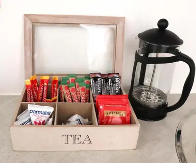 a box filled with different types of tea and a black tea istg at Green Scape Flatlet in Pretoria