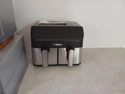 a black and silver coffee maker sitting on a counter at Green Scape Flatlet in Pretoria