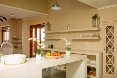 a kitchen with a counter with a bowl of fruit on it at Vetho Farmhouse Dullstroom in Dullstroom