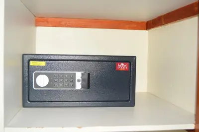 a small microwave on a wall in a room at Tengo guest house in Phalaborwa