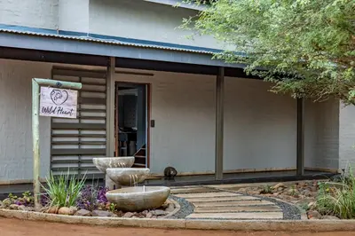 a building with a sign that reads wild fire at Wildheart Safari - MAIN in Hoedspruit