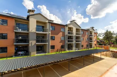 an image of an apartment building with a solar panels at Alimama Spaces: The Thando's Kyalami Woods in Midrand