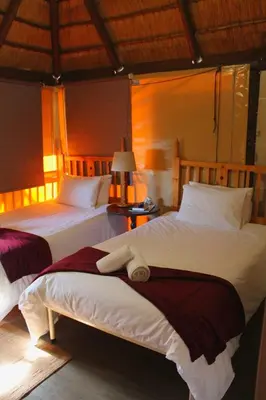 two beds sitting next to each other in a bedroom at Georeen Guest House in Polokwane