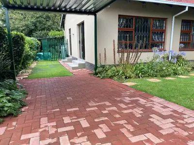 a brick walkway in front of a house at Garden and Park Leisure on Tugela in Benoni