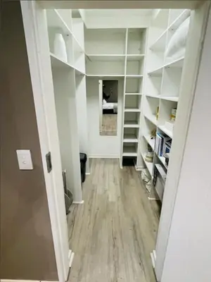 a hallway with white shelves in a room at Grace Gardens - Grace in Pretoria
