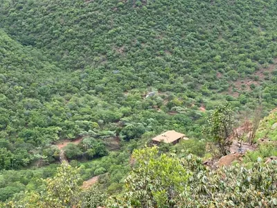 a small house on the side of a mountain at Waterfall Safari Lodge in Winterkamp