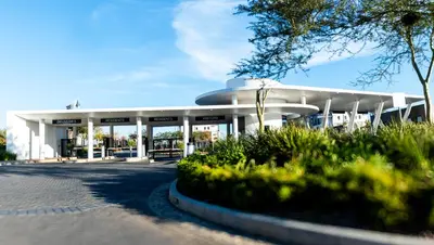 a large white building with apertureperture at Waterfall Apartments Waterfall Cres in Midrand