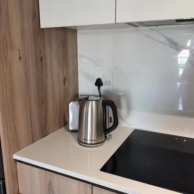 a tea kettle sitting on a counter in a kitchen at Waterfall Apartments Waterfall Cres in Midrand