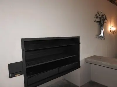a black television on a wall in a room at Balule Bushveld Safari Lodge in Phalaborwa
