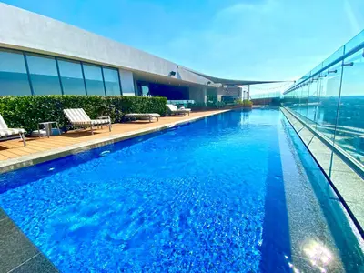 a swimming pool on top of a building at Menlyn Maine Residences - Kyoto king size xl bed in Pretoria