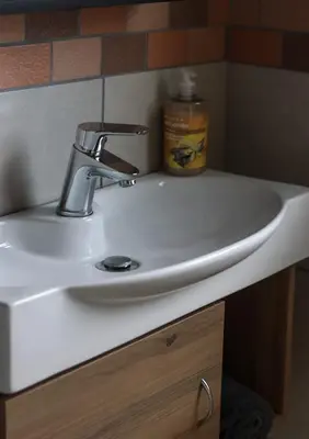 a bathroom sink with a faucet on top of it at Big D Accommodation & guesthouse in Northam