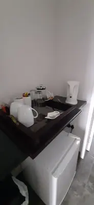 a table with a black counter top in a room at Kings B&B in Lake Chrissie