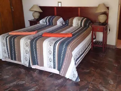 a large bed with two pillows on it at Hornbill Private Lodge Mabalingwe in Mabula
