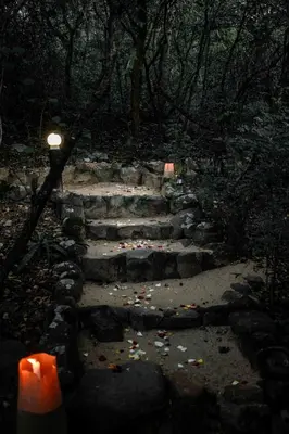 a set of stone stairs with a lit candle at Thulamela Couples Retreat in Hazyview