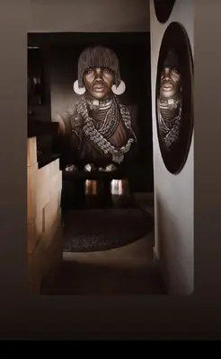 a statue of a woman sitting on the stairs at African Flair Boutique Safari Lodge in Hoedspruit