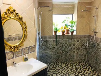 a bathroom with a sink and a mirror at Grafiti Boutique Hotel in Bela-Bela