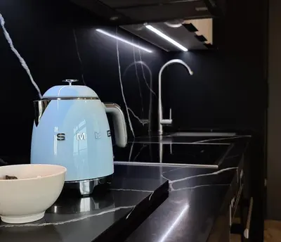 a mixer sitting on a kitchen counter next to a sink at Luxurious Menlyn Maine 1 Bedroom on 12th Floor with Stunning Views & No Load Shedding in Pretoria
