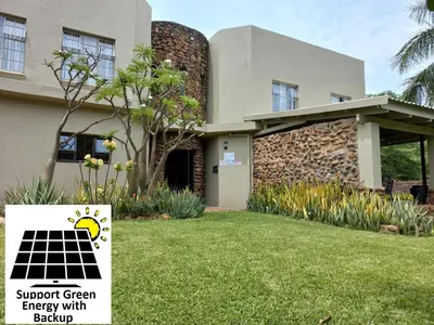 a house with a solar energy sign in front of it at SnL Guesthouse at Visarend in Malelane