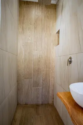 a bathroom with a sink and a shower at Boekenhout Accommodation in Pretoria