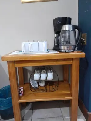 a table with cups and a coffee maker on it at Ebenezer Self Catering in Groblersdal