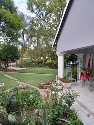 a porch of a house with a garden at Ebenezer Self Catering in Groblersdal