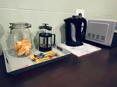 a tray with a coffee maker and a blender on a table at The Cottage at 152 in Centurion