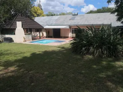 a house with a swimming pool in the yard at 15 On Reitz Bela bela in Bela-Bela