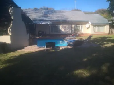 a house with a swimming pool in the yard at 15 On Reitz Bela bela in Bela-Bela